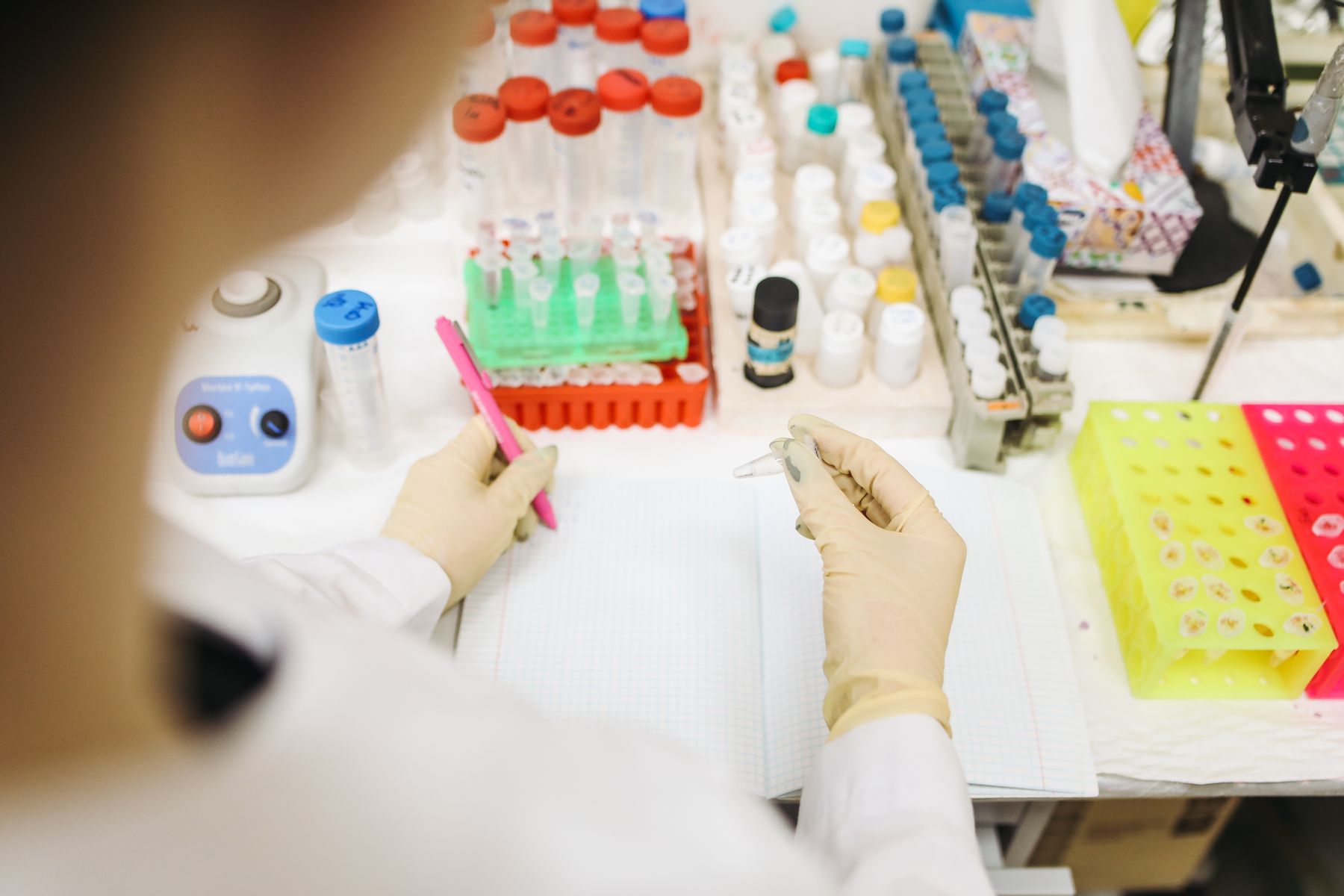 Laboratory specialist documenting sample quality-control results