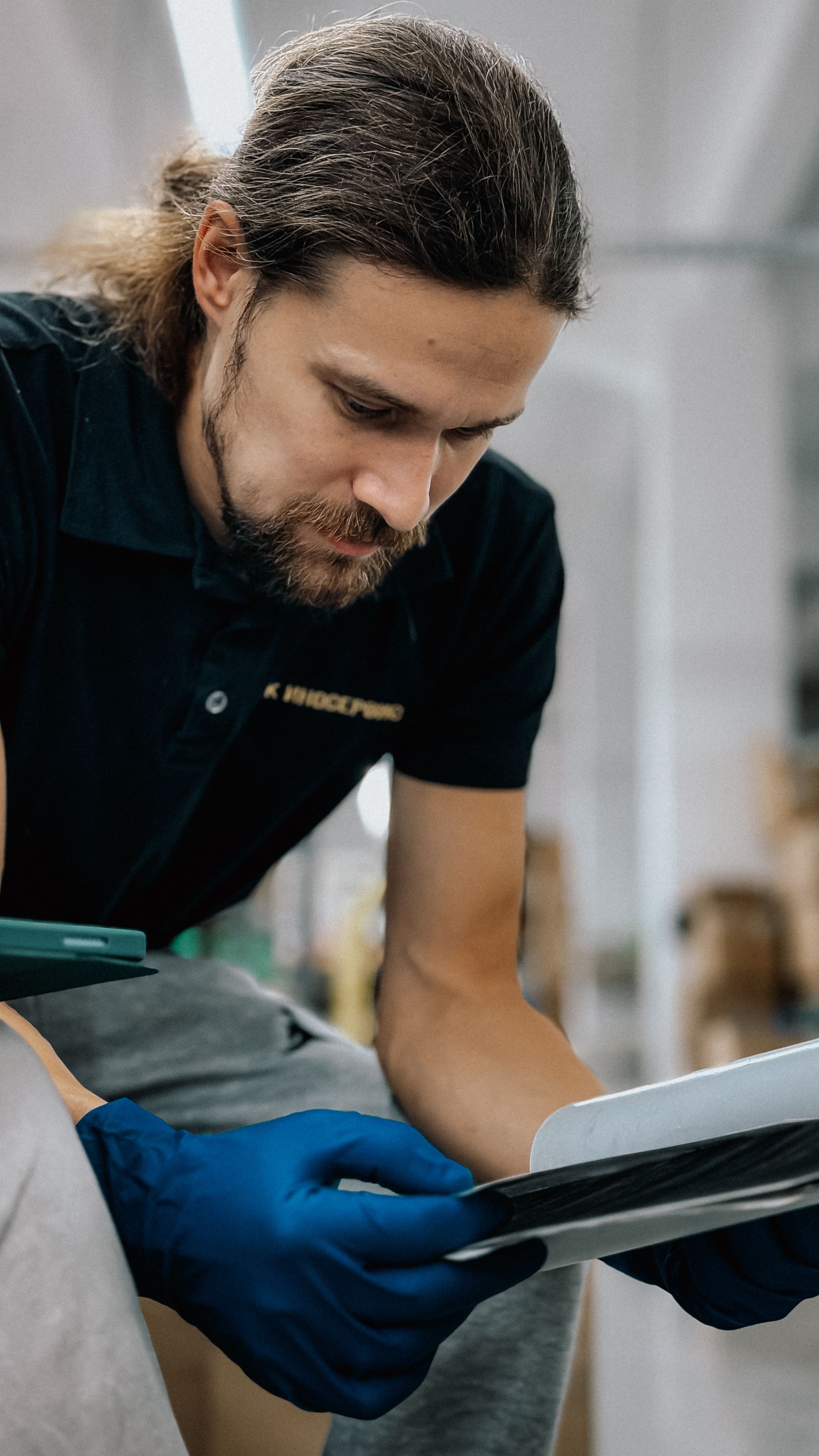 Quality specialist reviewing traceability information on a tablet