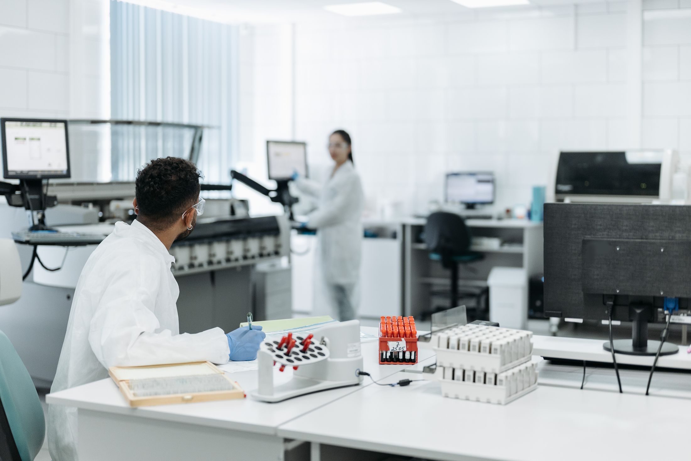Quality control specialists working in a modern laboratory