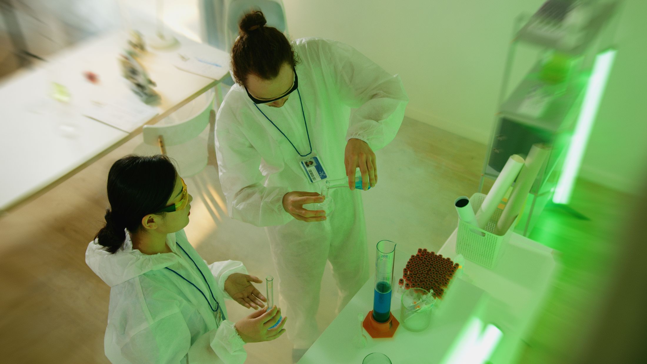 Scientists carrying out controlled laboratory work